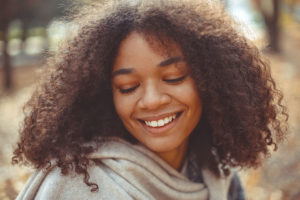 young woman thinking about her dental care
