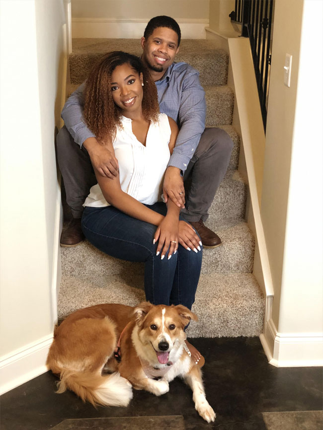 Dr. Bailey with his spouse and their dog.